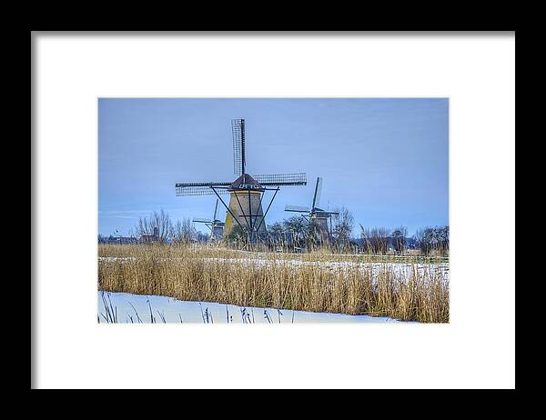 Windmill Framed Print featuring the photograph Kinderdijk Windmills in Winter by Frans Blok