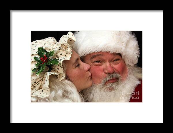 Mrs Claus Framed Print featuring the photograph Kissing Santa Claus by Joanne Coyle