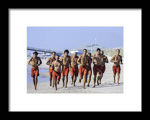  Life Guard Framed Print featuring the photograph Kure Beach Life guards on the run by WAZgriffin Digital