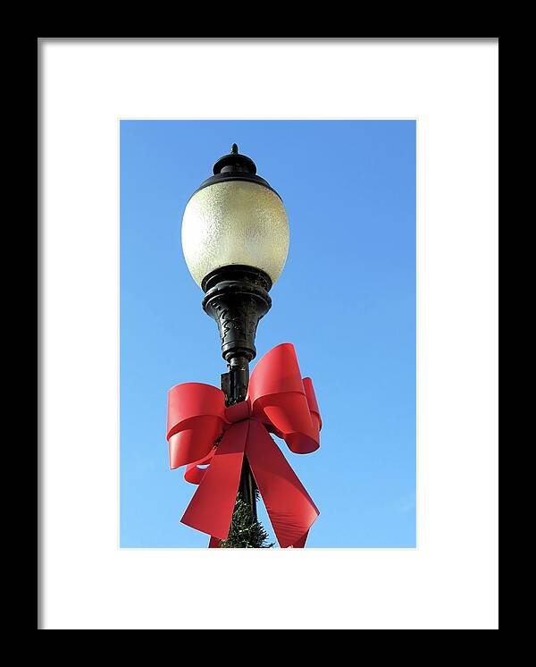 Lamp Post Framed Print featuring the photograph Lamp Post with Red Bow by Janice Drew