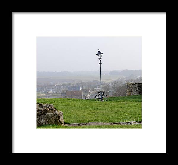 Lamppost Framed Print featuring the photograph Lamppost and bike. by Elena Perelman