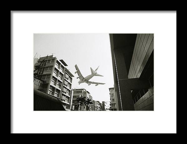 Flying Framed Print featuring the photograph Landing in Hong Kong by Shaun Higson