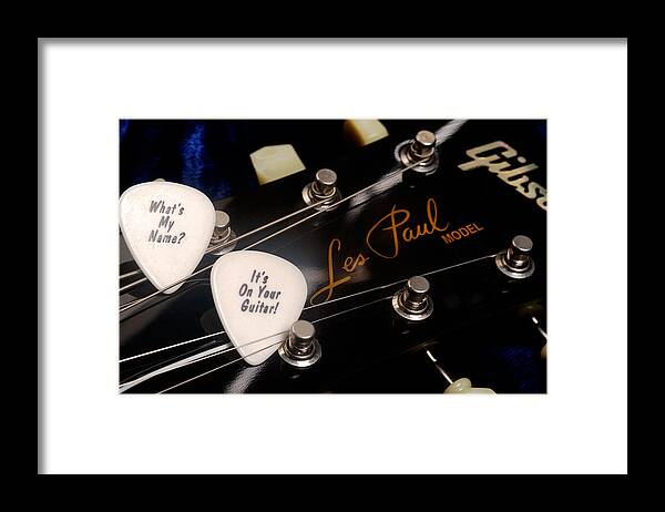 Les Paul Framed Print featuring the photograph Les Paul's guitar pick on Gibson headstock by Gene Martin by David Smith