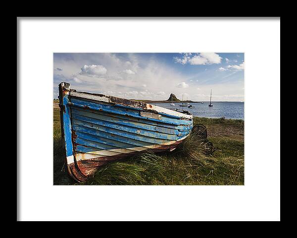 Northumberland Framed Print featuring the photograph Lindisfarne boats - Landscape. by John Paul Cullen