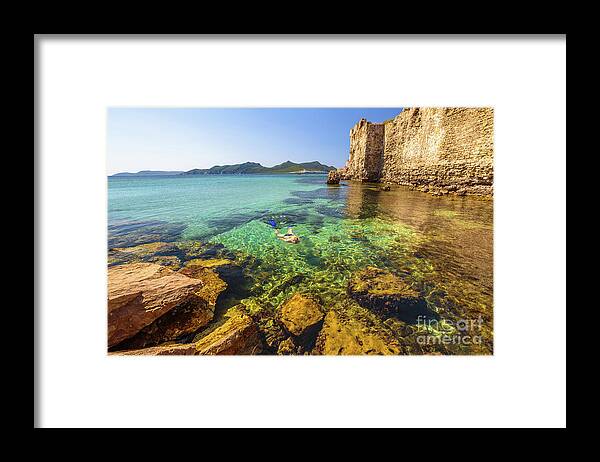 Woman Snorkeling Framed Print featuring the photograph Looking For Fishes by Benny Marty