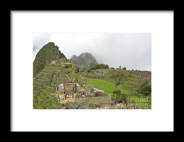 Peru Framed Print featuring the photograph Machu Picchu in the clouds by Ksenia VanderHoff