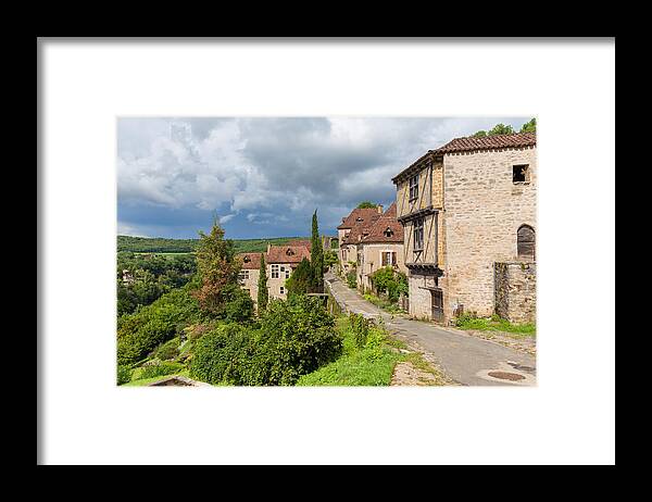 Blue Framed Print featuring the photograph Main treet in Saint Cirq Lapopie in France by Semmick Photo