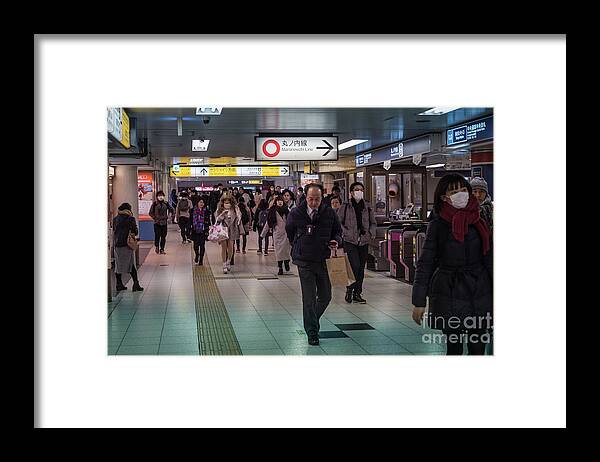 Pedestrians Framed Print featuring the photograph Marunouchi Line, Tokyo Metro Japan by Perry Rodriguez
