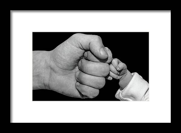New Born Framed Print featuring the photograph New born fist bump by Joe Holley