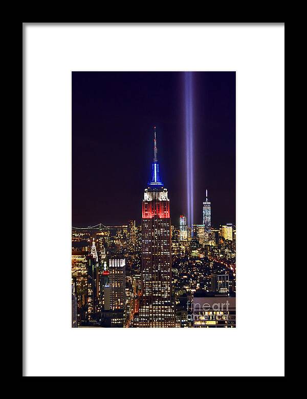 New York City Skyline At Night Framed Print featuring the photograph New York City Tribute in Lights Empire State Building Manhattan at Night NYC by Jon Holiday