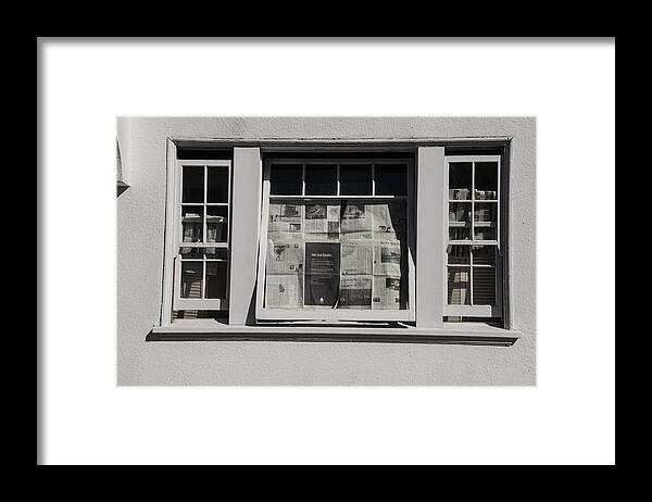 Shadow Framed Print featuring the photograph Newspaper Window by Erik Burg