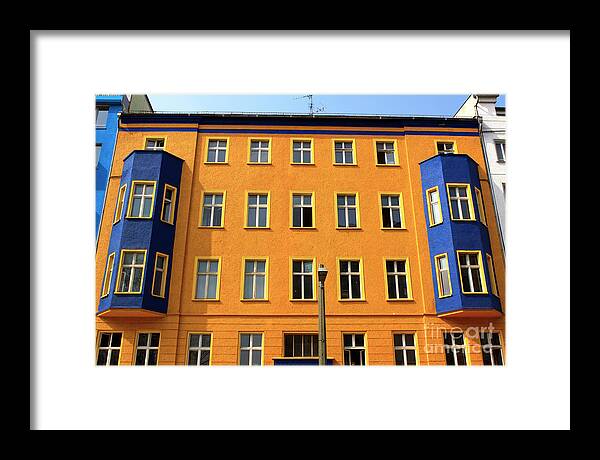 Orange And Blue In East Berlin Framed Print featuring the photograph Orange and Blue in East Berlin by John Rizzuto