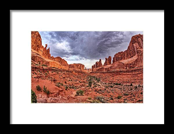 Moab Framed Print featuring the photograph Park Avenue with Storm Clouds - Arches NP by Kyle Lee