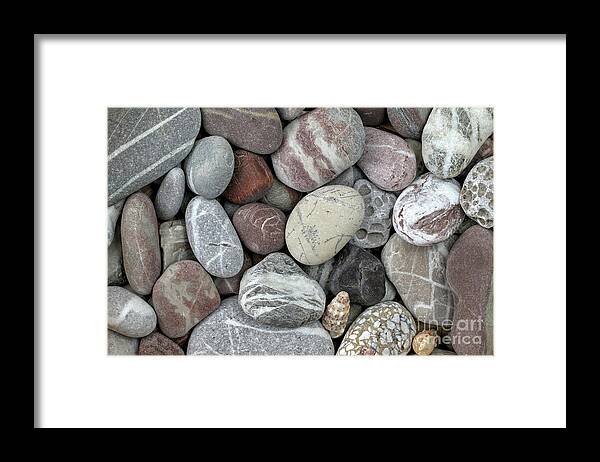 Stone Framed Print featuring the photograph Pebbles in earth colors - stone pattern by Michal Boubin