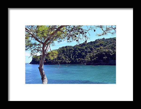 Italy Framed Print featuring the photograph People in the water and boats in Portofino, Italy by Oana Unciuleanu