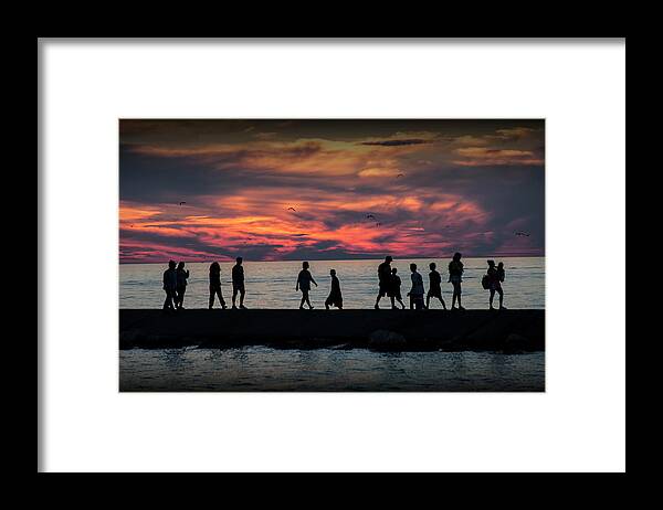 Art Framed Print featuring the photograph People walking on the Breakwater at Ottawa Beach at Sunset by Randall Nyhof