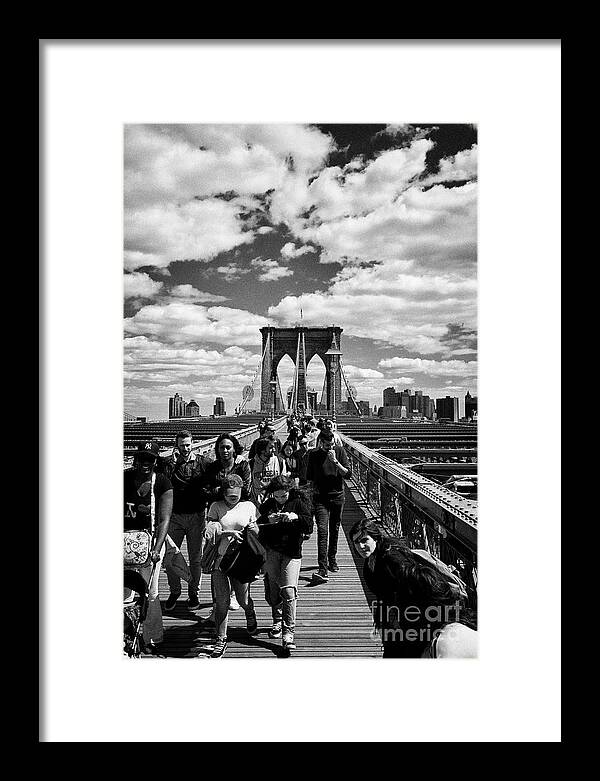 Brooklyn Framed Print featuring the photograph people walking over the brooklyn bridge New York City USA by Joe Fox