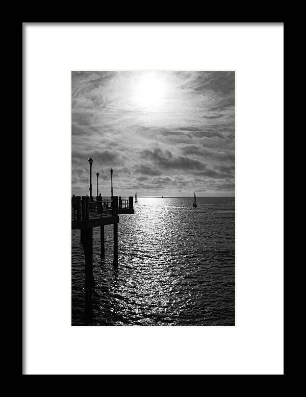 Sun Framed Print featuring the photograph Pier into the Sun by Michael Hope