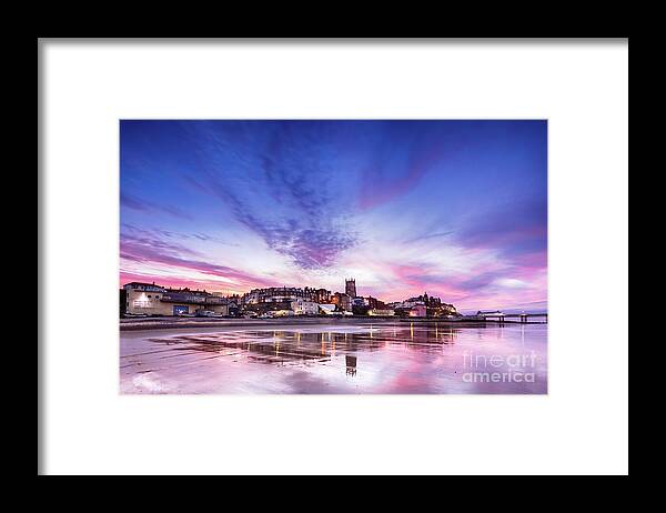 Cromer Framed Print featuring the photograph Pink sunset reflections over Cromer town at dusk by Simon Bratt