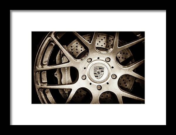 Porsche Wheel Emblem Framed Print featuring the photograph Porsche Wheel Emblem -1323s by Jill Reger