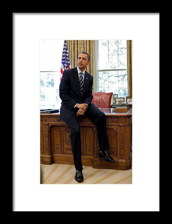 History Framed Print featuring the photograph President Barack Obama Sits On The Edge by Everett