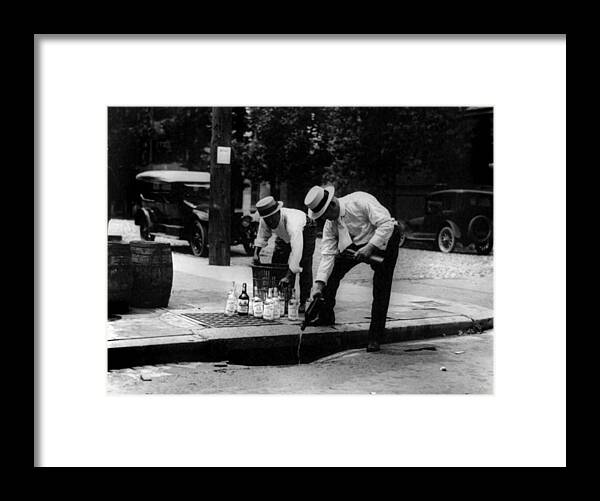 1920s Candid Framed Print featuring the photograph Prohibition, Pouring Whiskey by Everett