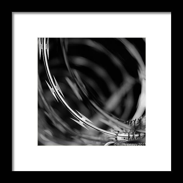 Black & White Framed Print featuring the photograph Razor Wire Up Close by Mark Peavy