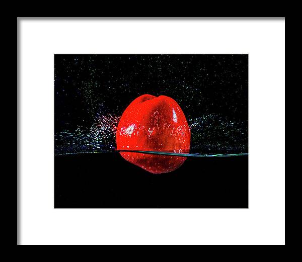 Photograph Framed Print featuring the photograph Red Apple splash by Terril Heilman