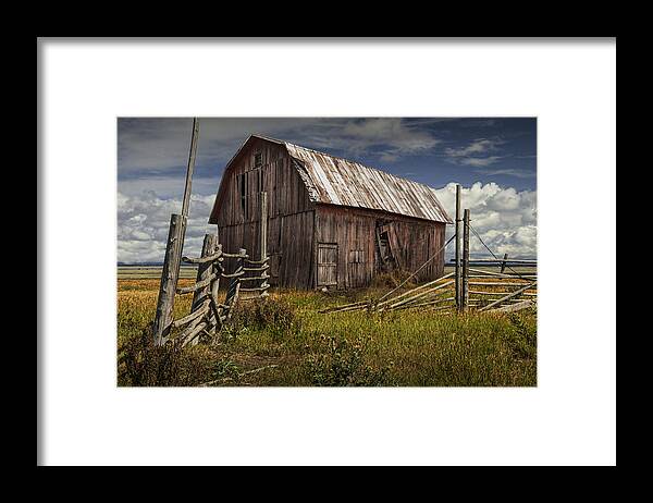 Wood Framed Print featuring the photograph Red Barn with Wood Fence on an Abandoned Farm by Randall Nyhof
