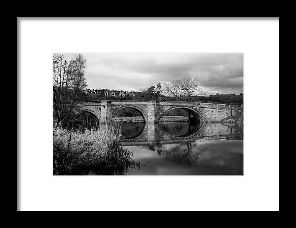 B & W Framed Print featuring the photograph Reflecting Oval Stone Bridge in Blanc and White by Dennis Dame