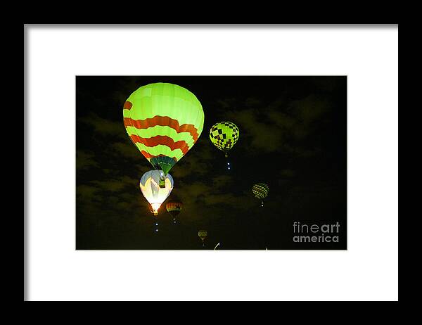 Hot Air Balloons Framed Print featuring the photograph Rising in early dawn by Jeff Swan