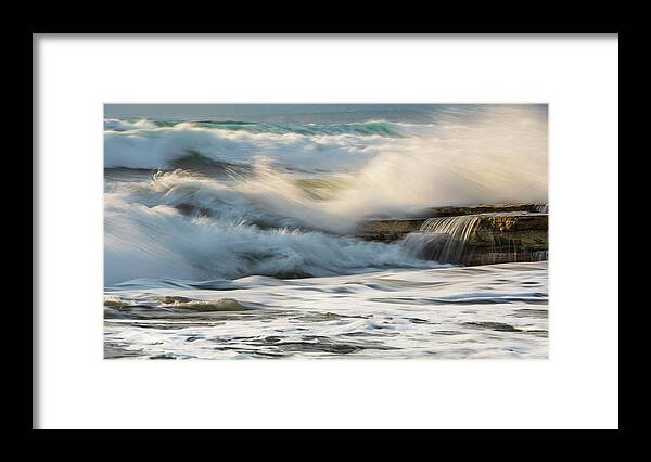 Sea Waves Framed Print featuring the photograph Rocky seashore, wavy ocean and wind waves crashing on the rocks by Michalakis Ppalis