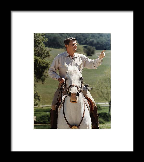 Ronald Reagan Framed Print featuring the photograph Ronald Reagan On Horseback by War Is Hell Store