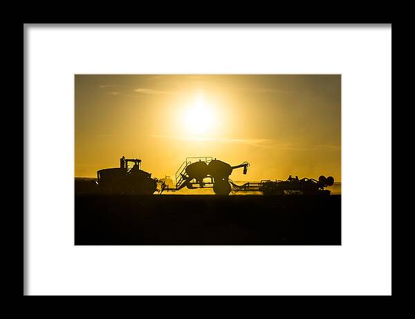 Farmeing Framed Print featuring the photograph Sillhouette of Tractors Planting Wheat by Todd Klassy