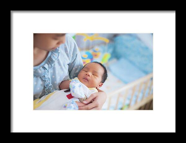 Baby Framed Print featuring the photograph Sister takecare asian new born baby to sleep by Anek Suwannaphoom