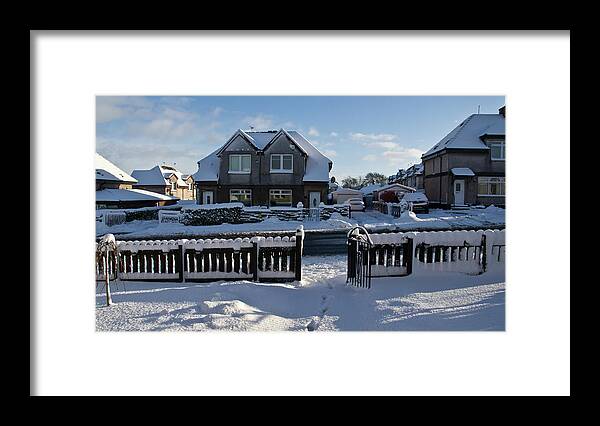Village Framed Print featuring the photograph Snow in a village by Elena Perelman