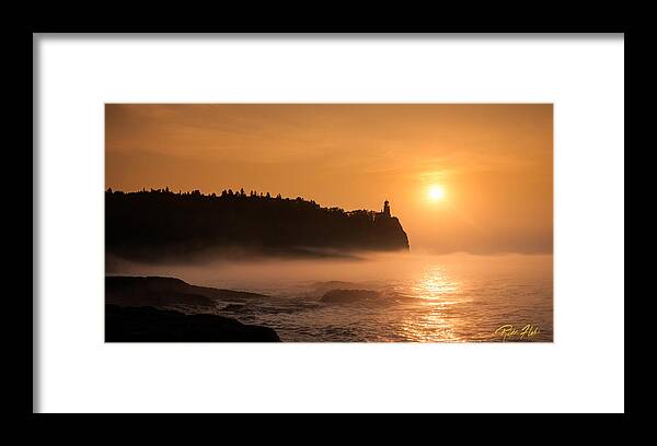 Atmosphere Framed Print featuring the photograph Split Rock's Morning Glow by Rikk Flohr