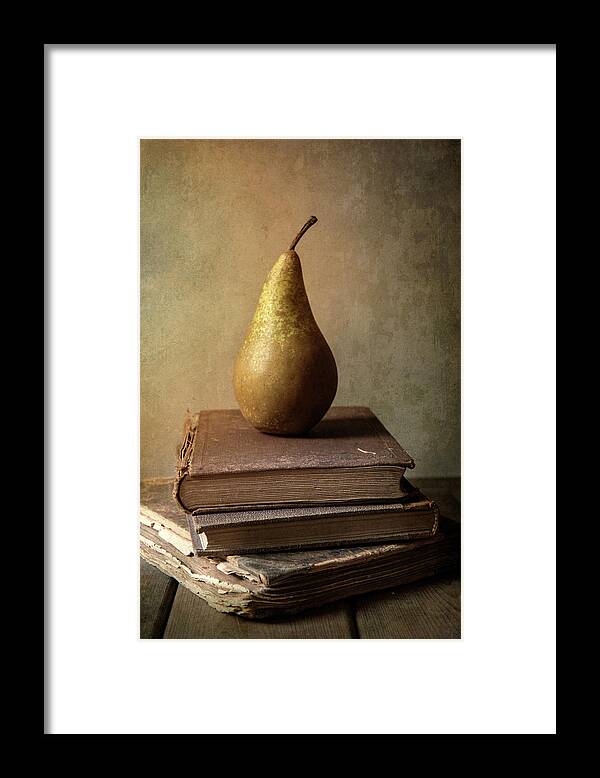 Book Framed Print featuring the photograph Still life with old books and fresh pear by Jaroslaw Blaminsky