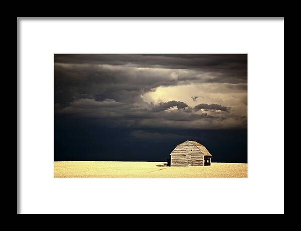 Abandoned Framed Print featuring the digital art Storm clouds behind abandoned Saskatchewan barn by Mark Duffy