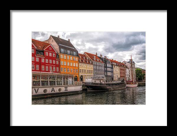 Copenhagen Framed Print featuring the digital art Storm Clouds Over Nyhavn by Mick Burkey
