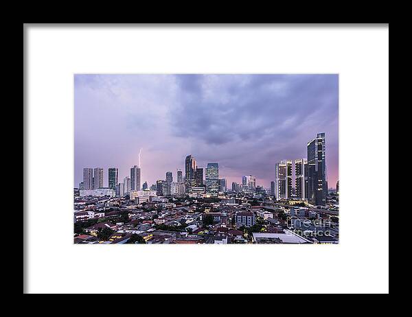 Capital Cities Framed Print featuring the photograph Stunning sunset over Jakarta, Indonesia capital city by Didier Marti