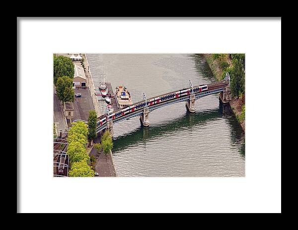 Subway Framed Print featuring the photograph subway train outdoors on a bridge over Seine river by Ioan Panaite