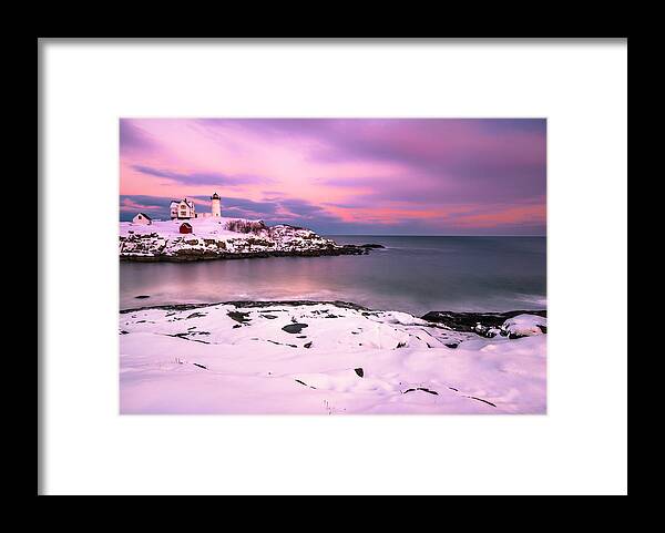 Maine Framed Print featuring the photograph Sunset at Nubble Lighthouse in Maine in Winter Snow by Ranjay Mitra