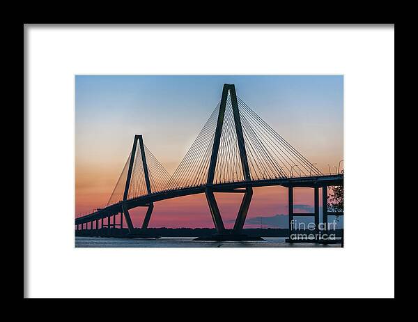 Arthur Ravenel Jr. Bridge Framed Print featuring the photograph Sunset Glow over the Cooper River Bridge by Dale Powell