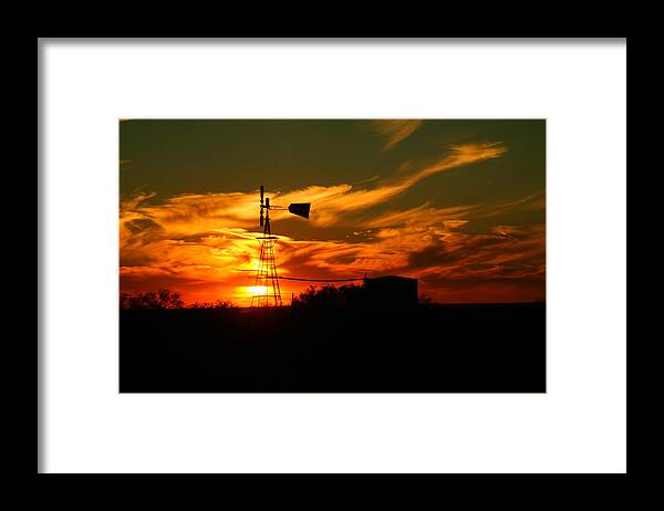 Wind Mill Framed Print featuring the photograph Sunset on a windmill Jal New Mexico by Jeff Swan