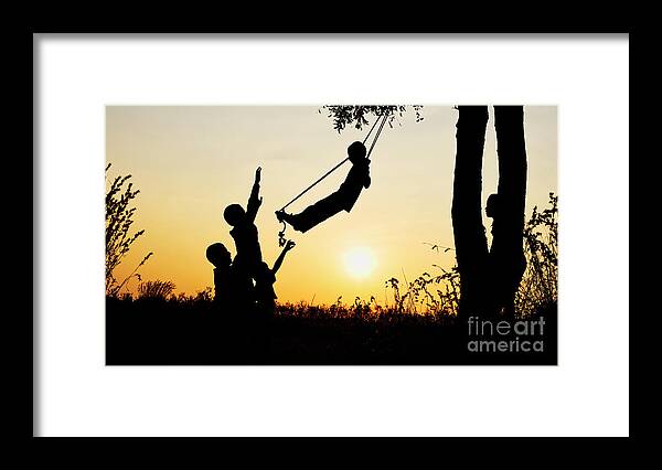 Indian Boys Framed Print featuring the photograph Sunset Silhouette Swing by Tim Gainey