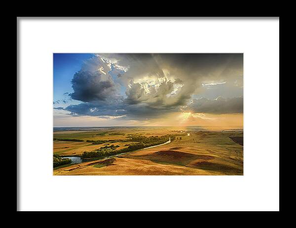 Hilltop Framed Print featuring the photograph Sunset Through the Rain Clouds by John Williams