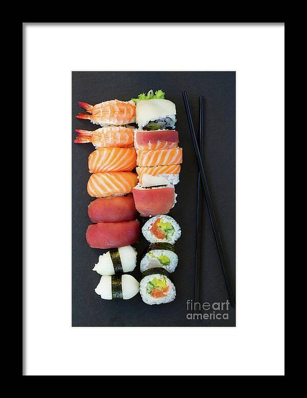 Sushi Framed Print featuring the photograph Sushi and Chopsticks by Anastasy Yarmolovich