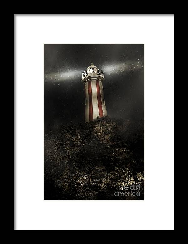 Mystery Framed Print featuring the photograph Tasmania lighthouse in rain storm. Guiding light by Jorgo Photography