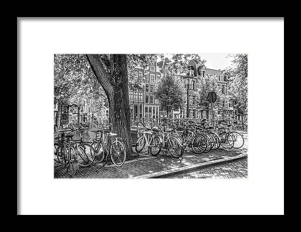 Spring Framed Print featuring the photograph The Bicycles of Amsterdam in Black and White by Debra and Dave Vanderlaan